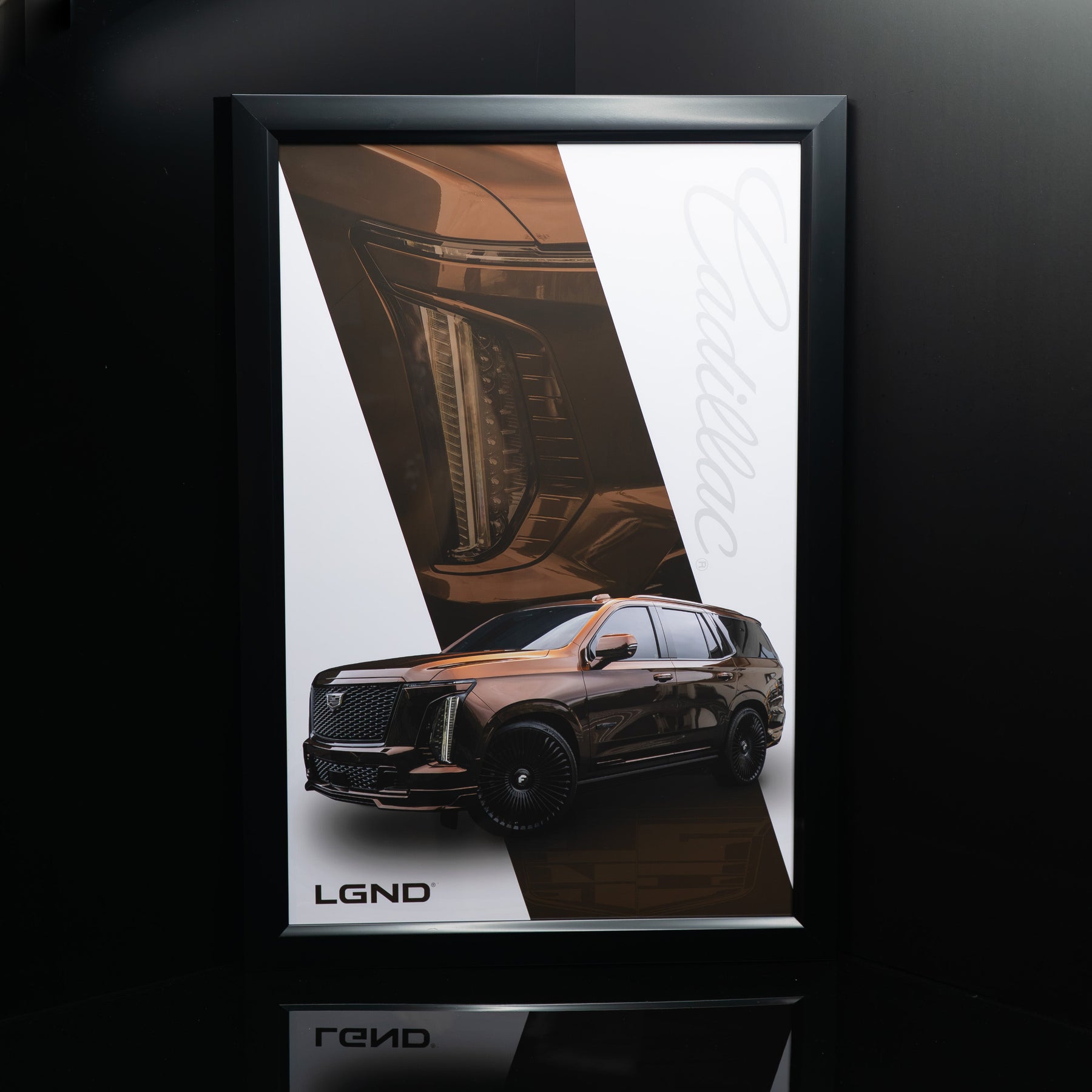 LGND Escalade-V Cadillac script poster in matte black frame, angled view